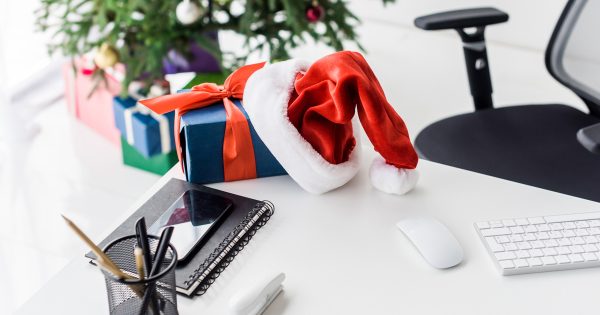 Three Ways to Reduce Risks During Holiday Travel Office desktop at Christmastime includes data security